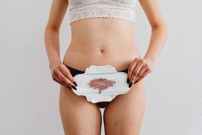 A Woman Holding a Menstrual Pad