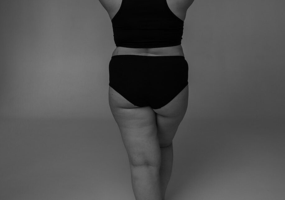 Black and White Studio Shot of Womans Back
