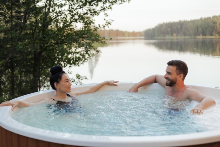 Couple Looking at Each Other while Relaxing in a Jacuzzi